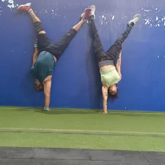 Working on gymnastics skills like handstands not only builds incredible upper body and core strength but also improves balance and spatial awareness. Plus, it's always fun to push each other to get better.