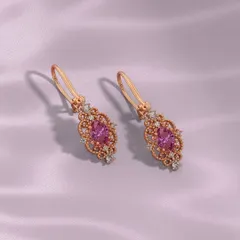 Every sparkle has a soul. These earrings shine with a story of grace, featuring a soft pink gemstone at the center, framed with delicate diamonds in an intricate setting. I craft custom designs so every piece becomes as unique as the woman who wears it.