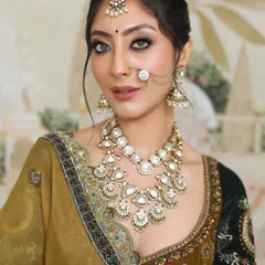 A close-up of a radiant and elegant bridal look, perfect for the big day. The makeup features a smokey eye and a flawless base.