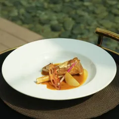 Our slow-braised lamb shank, so tender it falls off the bone, is served in a deeply layered sauce and paired with crisp lotus stem for a playful crunch. This dish is where texture meets depth, and tradition finds its modern table.