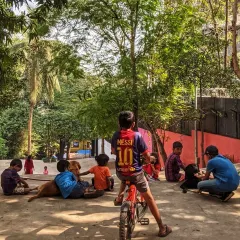 A quiet moment of community as children and dogs gather at the base of The Steps. Our designs prioritize creating safe and welcoming environments for all residents, including the four-legged ones.