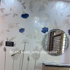 My mom and I collaborated on this viral gold foil mural. The delicate outlines of flowers and leaves on a soft, textured wall create a gentle and sophisticated ambiance.