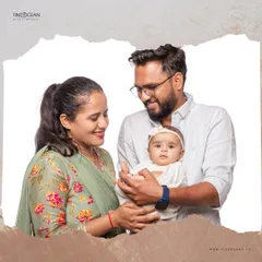 A candid moment between parents and their baby girl during a studio session. These unposed shots often become the most treasured, showing the real love and connection you share.