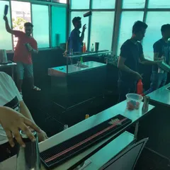The academy is buzzing with energy as students get hands-on with flair practice. This is where passion for bartending comes to life.