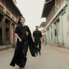 A dynamic shot of her running joyfully down an old city street, with him following behind. This tells a story of playful pursuit.