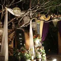 An atmospheric shot of a welcome area at night, with dramatic lighting and elegant decor.
