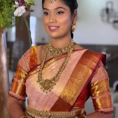 Another angle of Ranjitha's classic South Indian bridal look. The focus is on creating a balanced and elegant profile, with perfectly defined eyes and lips that complement her grand attire.