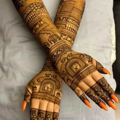 A stunning, dark henna stain on a full coverage design. The architectural and elephant motifs look even more striking with this deep, rich color.