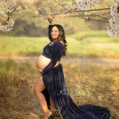 A solo portrait celebrating the pure joy of motherhood. Standing in a field of flowers, this mom-to-be was absolutely radiant, and the natural light made her glow even brighter.