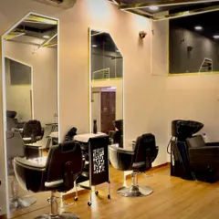 This view showcases our well-lit hair washing and styling stations. The layout is open and spacious, ensuring a comfortable and efficient visit whether you're here for hair, nails, or other beauty treatments.