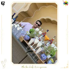 Our mixologist behind the bar, crafting another perfect cocktail with a smile.