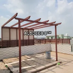 This image shows the clean and sturdy skeleton of a terrace pergola. The structure is made from mild steel (MS), painted to the client's preference, and ready for the roofing and other custom additions.