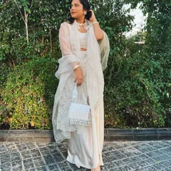 A full-length view of my cream-on-cream wedding guest look. The pearl choker and beaded bag were the perfect finishing touches.