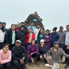 A fun group photo at the Kumaraparvatha peak, showing the diverse mix of people who join my treks.