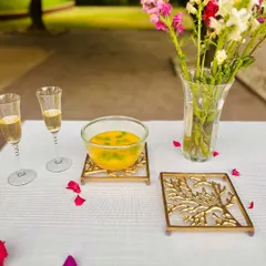 Protect your beautiful tabletops in style with our Nordic Sails trivets. Their sculpted, tree-like design in a golden finish not only holds hot dishes but also adds a touch of art to your dining table.