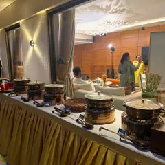 A full view of our premium buffet setup at a client's beautiful home. The combination of our copper chafing dishes and professional arrangement creates a luxurious dining experience for any private event.