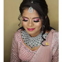 A close-up of Shruthi's reception makeup, showing the blended pink eyeshadow and flawless lashes.