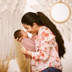 A mother's gentle touch and a baby's peaceful sleep. These are the quiet, intimate moments I aim to preserve during a newborn photography session.