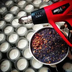 There's a science to candle making. After pouring, I use a heat gun to smooth the tops for a perfect finish. Then, the candles cure for a week to ensure the best possible scent throw before they are ready for you.