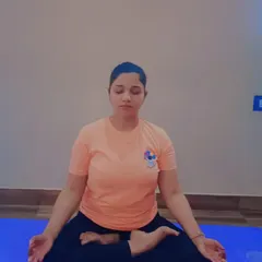 A student demonstrates Padmasana (Lotus Pose), a foundational meditative posture. This pose, combined with proper breathing, is highly effective for calming the mind and managing anxiety.