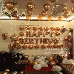 Another look at the rose gold setup, showing how the metallic balloons catch the light beautifully. A stuffed panda adds a cute and personal touch to the decoration.