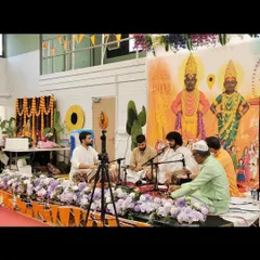 A wide shot of our performance for the Shree Vitthal Rukmini Temple Trust in the UK. The stage was beautifully decorated with images of the deities.