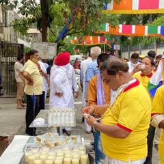 Serving the community is a core part of our 30-year legacy. Here we are distributing cool lassi and fresh snacks during a religious procession in Paschim Vihar.