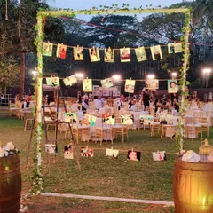 A wonderful way to share your love story with guests. We created this photo display using rustic barrels and string, where the couple could hang pictures from their journey together.