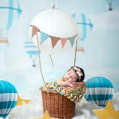 The full scene of the hot air balloon theme, complete with a sky backdrop, fluffy clouds, and stars to create a truly magical setting.