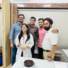 A photo of me and my team celebrating our 35th anniversary. The success of the clinic is a collective effort, and I am grateful for the dedication and expertise of every member of my staff.