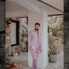 The groom deserves his own stylish portraits too. Here's Rajat looking dapper in his lavender outfit, captured in a quiet moment before the Mehendi festivities began.