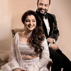 A candid laugh shared between the couple, capturing the genuine joy and comfort they find in each other's presence during a portrait session.