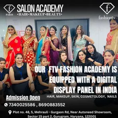 Our academy is equipped with modern tools like digital display panels to enhance the learning experience. Here, our certified students pose with models showcasing their final work.