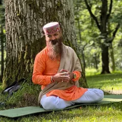 Seated under a tree, a quiet moment of reflection. The words in the original caption speak of resilience and staying true to one's path, even when faced with criticism.