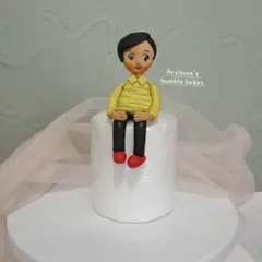 A close-up of a human figure made entirely from fondant. I teach the techniques to shape, structure, and add fine details to bring your characters to life.