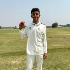 Parnit Tiwari holds the ball after a destructive spell where he took 8 wickets for just 1 run. This is the kind of match-winning performance our program aims to produce.