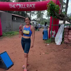 A proud moment at the finish line of "The Hell Race" in Goa, medal in hand. These races are about grit over glory.