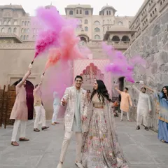A pastel wonderland comes to life with bursts of pink and purple smoke. This shot from a pre-wedding celebration at Fairmont Jaipur showcases our ability to create dynamic, colorful, and joyful moments.