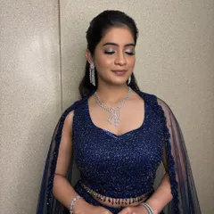 This is what I mean by shimmer. For this Sangeet night, I created a captivating silver and blue smokey eye that sparkles with every glance. It's a bold statement that is still elegant and refined.
