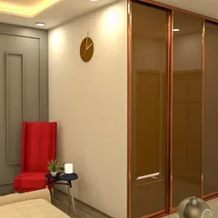A bedroom featuring a large wardrobe with reflective bronze-tinted sliding doors. This custom piece adds a touch of glamour and makes the room feel more spacious.