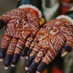 A close-up of the intricate patterns on the palm after the henna paste has been removed. The dark stain shows the quality of the natural henna used.