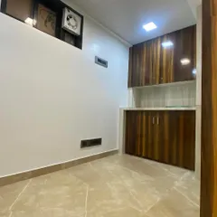 This image shows the custom cabinetry and storage unit I built for the office. The dual-tone wood laminate finish adds warmth to the space, providing essential storage without compromising on design. Every piece of furniture is built to fit the specific layout and needs of the client.