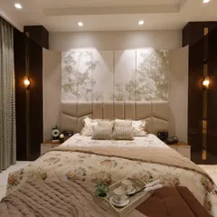 For this master bedroom in Delhi, the goal was timeless tranquility. I used a soft, neutral palette, a custom upholstered headboard with nature-inspired panels, and layered lighting to craft a warm, refined sanctuary that feels like a lasting comfort.