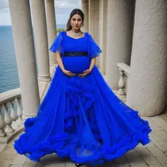 Make a bold and beautiful statement with our royal blue ruffle gown. The vibrant color and cascading layers of tulle create incredible volume and texture, ensuring you stand out in every single photo.