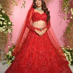 Giving the sister of the groom her main character moment. We styled her in a glamorous look with radiant makeup to complement her stunning red lehenga.