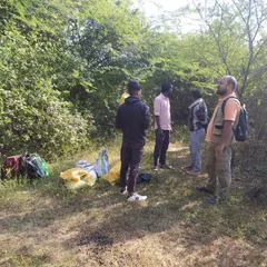 Discussing our plan of action for the day. Teamwork and local knowledge are essential to our success in the field.