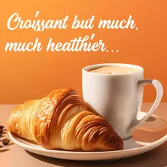 A classic, buttery croissant paired with a perfectly brewed coffee. This image captures the essence of a perfect morning break at my café, highlighting our commitment to authentic French viennoiserie.