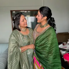 An adorable mother-daughter moment at a home Mehndi. It's so special to get to glam up the whole family for these celebrations.