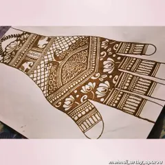 Here is another design concept on paper. This sketch helps me visualize the flow of the pattern across the hand, ensuring the peacocks, florals, and geometric fills work together harmoniously.
