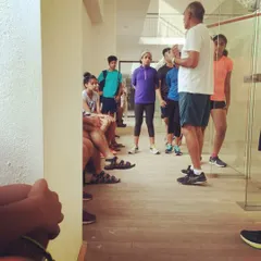 Our players listen intently as a coach explains the nuances of reflex training. These group discussions are a vital part of our coaching philosophy.